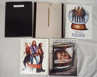 1025 LOT OF FIVE MOVIE PRESS KITS. LOT INCLUDES; THERE'S SOMETHING ABOUT MARY, TRAPPED IN PARADISE, THE TRUMAN SHOW, AIRHEADS, & LITTLE NICKY. KITS CONTAIN STILLS, PRODUCTION INFO ETC.