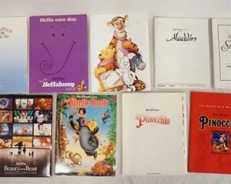 1036 LOT OF DISNEY FILM MEMORBILIA & PRESS KITS. LOT INCLUDES A PRESS KITS FOR PINOCCHIO A COMMEMORTIVE LITHOGRAPH & A BOOK ON THE MAKING OF PINOCCHIO. PRODUCTION INFO FOR ALADDIN & SNOW WHITE, THE JUNGLE BOOK, BEAUTY & THE BEAST SPECIAL EDITION PRESS KIT, PIGLETS BIG MOVIE, POOH'S HEFFALUMP MOVIE, & WINNIE THE POOH & CHRISTMAS TOO.