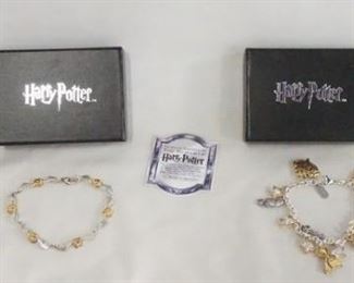 1085 LOT OF TWO THE NOBLE COLLECTION HARRY POTTER STERLING SILVER BRACLETS. ONLY THE CHAIN IS MARKED STERLING ON CHARM BRACELET. BOTH COME IN ORIGINAL BOXES.