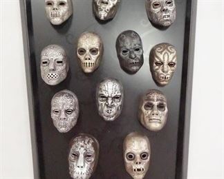 1088 HARRY POTTER THE NOBLE COLLECTION DEATH EATER MASK COLLECTION ON PLAQUE. 16 1/4 IN X 12 IN .