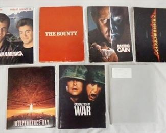 1141 LOT OF SEVEN MOVIE PRESS KITS INCLUDING AIR AMERICA; CONTAINS STILLS FROM THE FILM INCLUDING 3 SIGNED, A SCREENING INVITATION & PRODUCTION INFO. THE BOUNTY; CONTAINS STILLS INCLUDING ONE SIGNED & PRODUCTION INFO. TOP GUN; CONTAINS STILLS, SCREENING INVITATIONS, & PRODUCTION INFO. INDEPENDENCE DAY; CONTAINS SCREENING INVITATIONS COLOR COLOR PRINTS INCLUDING ONE SIGNED, A PATCH STILLS & PRODUCTION INFO. CASUALITIES OF WAR; CONTAINS STILLS & PRODUCTION INFO. ARMAGEDDON; CONTAINS A SIGNED PRINT, SCREENING INVITATION, STILLS & PRODUCTION INFO. & RAISING CAINE; CONTAINS STILLS, SCREENING INVITATION & PRODUCTION INFO.