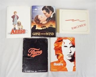 1151 LOT OF 5 MOVIE PRESS KITS INCLUDING, ANNIE; CONTAINS 12 STILLS & PRODUCTION INFO, GONE WITH THE WIND (1998 RE-RELEASE) CONTAINS 5 STILLS & PRODUCTION INFO. THE DOORS; CONTAINS 14 STILLS & PRODUCTION INFO. FAME; CONTAINS 12 STILLS & PRODUCTION INFO. & WAR OF THE ROSES; CONTAINS 9 STILLS & PRODUCTION INFO.