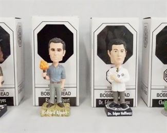 1165 LOT OF FOUR LOST DHARMA INITATIVE BOBBLE HEADS INCLUDING HURLEY REYES, RICHARD ALPERT, DR. EDGAR HALLIWAX & CLAIRE LITTLETON BY BIF BANG POW W/ ORIGINAL BOXES.