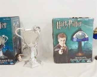 1173 LOT OF TWO NECA HARRY POTTER TABLE LAMPS W/ ORIGINAL BOXES. LOT INCLUDES THE TRIWIZARD CUP 12 IN H, & HOGWARTS TIFFANY STYLE LAMP APP. 15 IN H