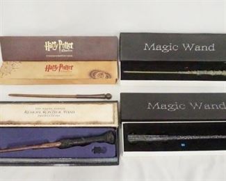 1181 LOT OF FOUR WANDS W/ BOXES. A HARRY POTTER THE EXHIBITION COMMEMORATIVE WAND, THE HARRY POTTER REMOTE CONTROL WAND & TWO MAGIC WANDS
