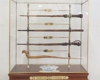 1185 HARRY POTTER THE NOBLE COLLECTION TRIWIZARD CHAMPIONS WAND DISPLAY W/ 4 WAND REPLICAS FOR HARRY POTTER, CEDRIC DIGGORY, FLEUR DELACOUR & VIKTOR KRUM. 17 1/4 IN X 16 1/2 IN, 5 1/4 IN DEEP.