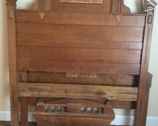 Antique walnut high back bed.   Has been converted to accommodate full mattress