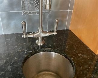 small stainless sink and faucet