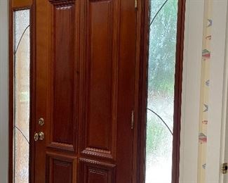 The glass panels surrounding this door are for sale.