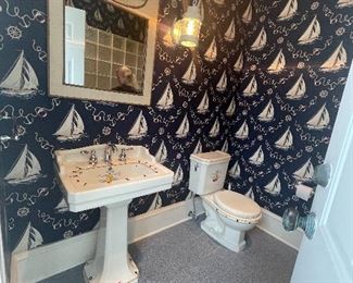 nautical theme bathroom: sink, toilet, mirror