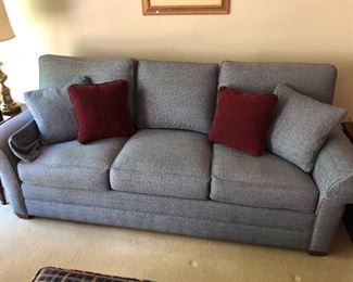 Blue/grey upholstered couch by Ethan Allen.