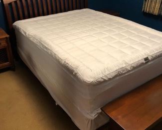 Queen-size bed with near-new Jonathan Stevens mattress, box spring and Cuddlebed Ultimate mattress pad, all in excellent condition.