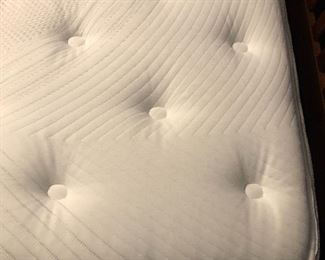 Close-up look at Jonathan Stevens mattress, in excellent condition with little use.