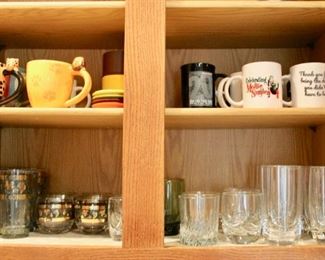 Selection of drinkware, including drinking glasses and coffee mugs.