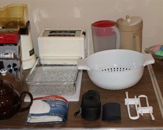 Kitchen items, including small appliances, cookware, teapots, etc.