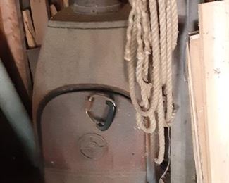 Wood burner.  Comes with firesafe concrete pad