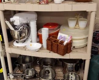 Kitchen-Aid mixer, pots and pans and other kitchen items.