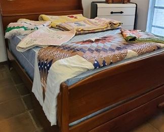 Entire room full of beautiful vintage quilts