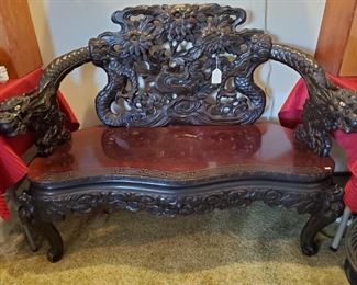 Stunning C. 1900 Qing Dynasty carved rosewood "dragons" loveseat in remarkable condition.