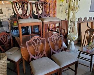 6 chair drop leaf dining set with 4 leaves.