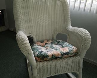 #6 $25.00 - White faux wicker rocking chair (some unraveling on the back)