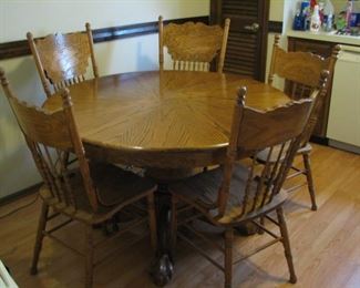 #3 $75.00 - 48" Round oak dining/kitchen table w/5&nbsp;press back chairs (top some condition issues)