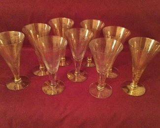 Dorothy Thorpe gold fleck wine stems.  There are 9.  6”