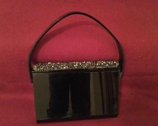 Vintage black lucite with rhinestone and jet enhancements.   