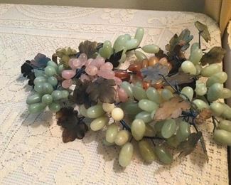 Alabaster grape clusters with jade leaves.  There are 7 
