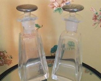 Vintage vinegar and oil cruets. Ground glass stoppers sterling silver lids 