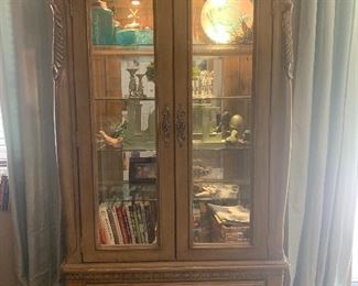 Beautiful lighted cabinet with glass shelves. Lots of storage