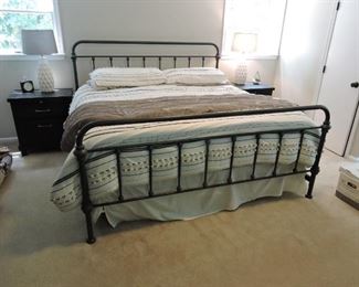 King bed with wrought iron head and foot board frame