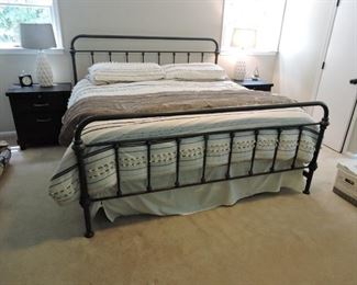 King bed with wrought iron head and foot board frame
