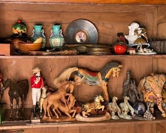 Collectibles and lots of horses in different forms and materials, Buddha riding on a horse