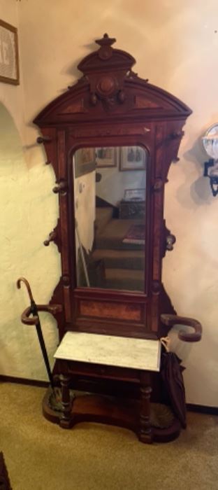 c1870 Mahogany stunning hall tree, umbrella stand, and hat and coat holder with white marble seat and large beveled mirror. Very tall.