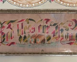 Punched paper embroidery, can 1880, “God Bless Our Home”, green red and green with an embroidered home, trees and the sea