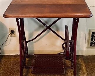 Sewing table with iron treadle base