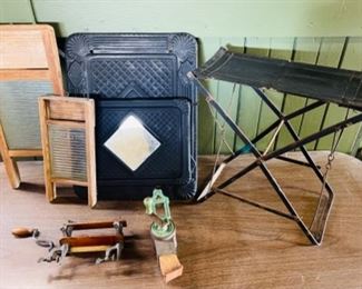 Miniature wash boards, a Victorian metal magazine rack with mirror, a folding ball game seat, miniature hand clothes wringer, and a small kitchen grinder