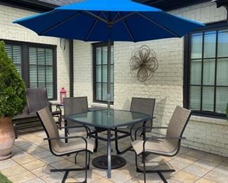 Outdoor table, chairs and Sunbrella umbrella