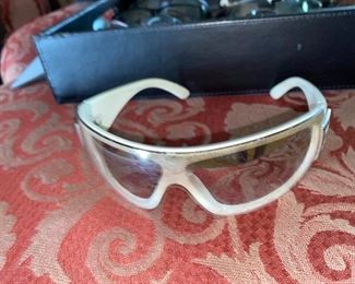 Chanel sunglasses, VERY used. (Lens scratched, ear chewed.)