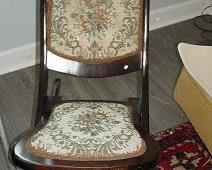 This has been described as a vintage 'sewing chair', with needlepoint backing. $95.
