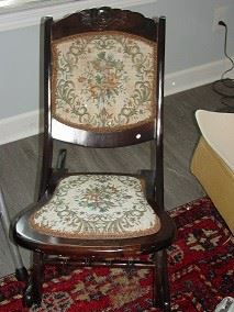 This has been described as a vintage 'sewing chair', with needlepoint backing.  $95.