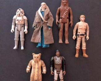 Vintage STAR WARS Figures - Chewbacca: 1977; Luke Skywalker: 1980; AT-AT Driver:1980; Lando Calrissian, Skiff Guard: 1982; Alien Twi'lek Bib Fortuna: 1983; Logray Ewok: 1983