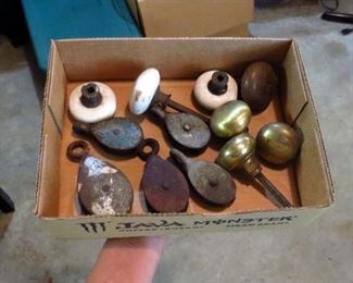 Brass doorknobs and small pulleys