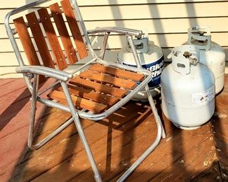 Folding lawn chair & three butane tanks
