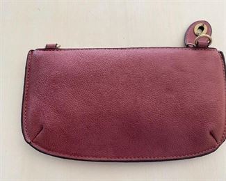 Joy Susan rose colored leather clutch purse