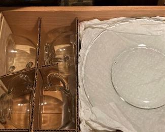 One of several crates of cups and dessert plates