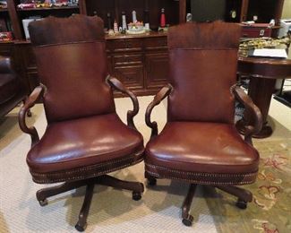 2 leather and cow hide desk chairs.