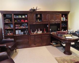 Large mahogany office work unit with attached desk.