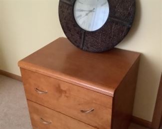 Two drawer file cabinet measures 29” w x 21” d x 28” h.  Presale $25  metal clocks 24” round $20